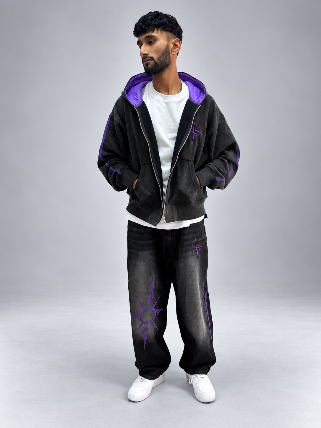 Model wearing the Drop 001 zip hoodie and jeans